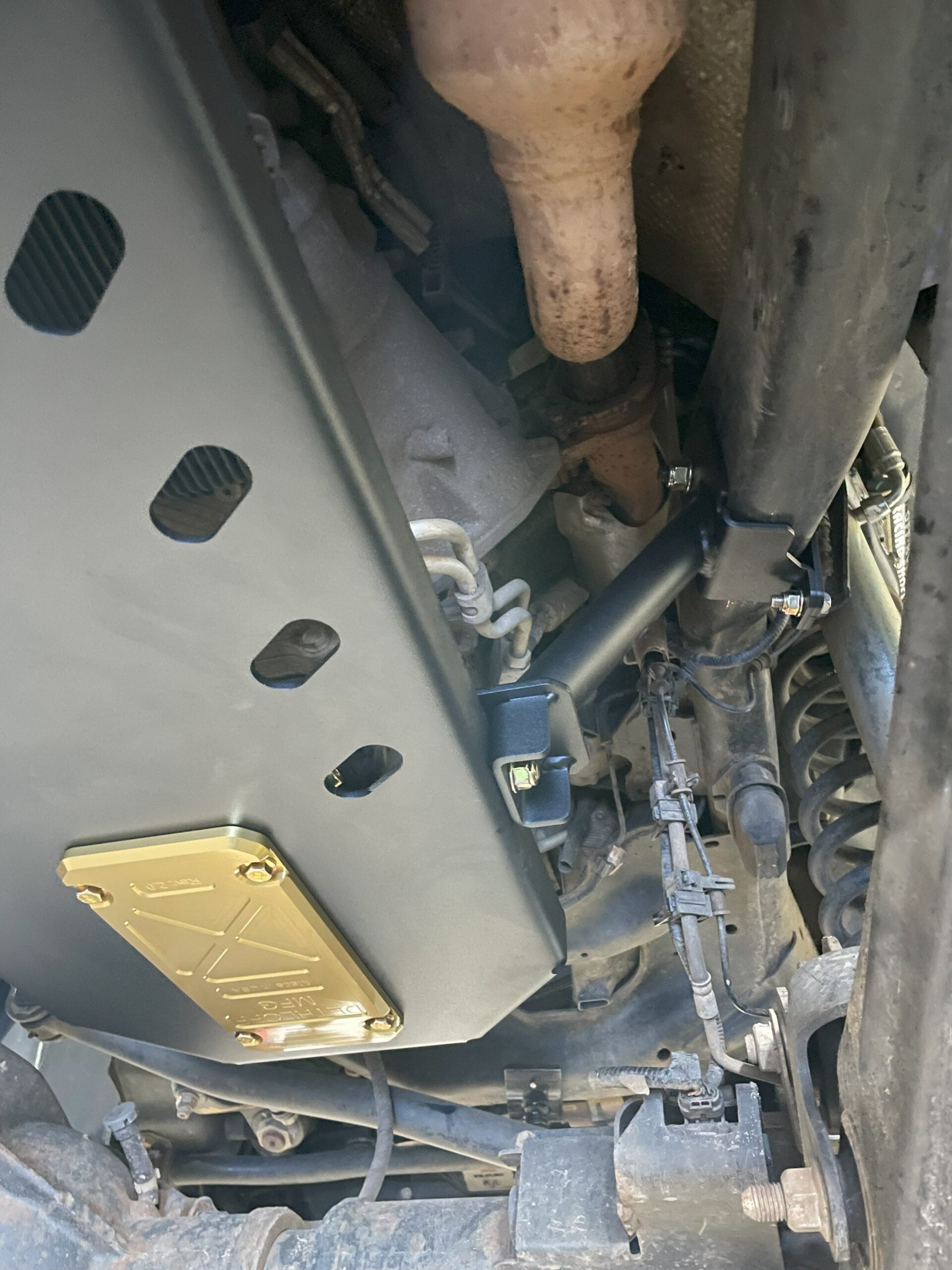 Side of the fitted plate with a gold service panel near its lower corner