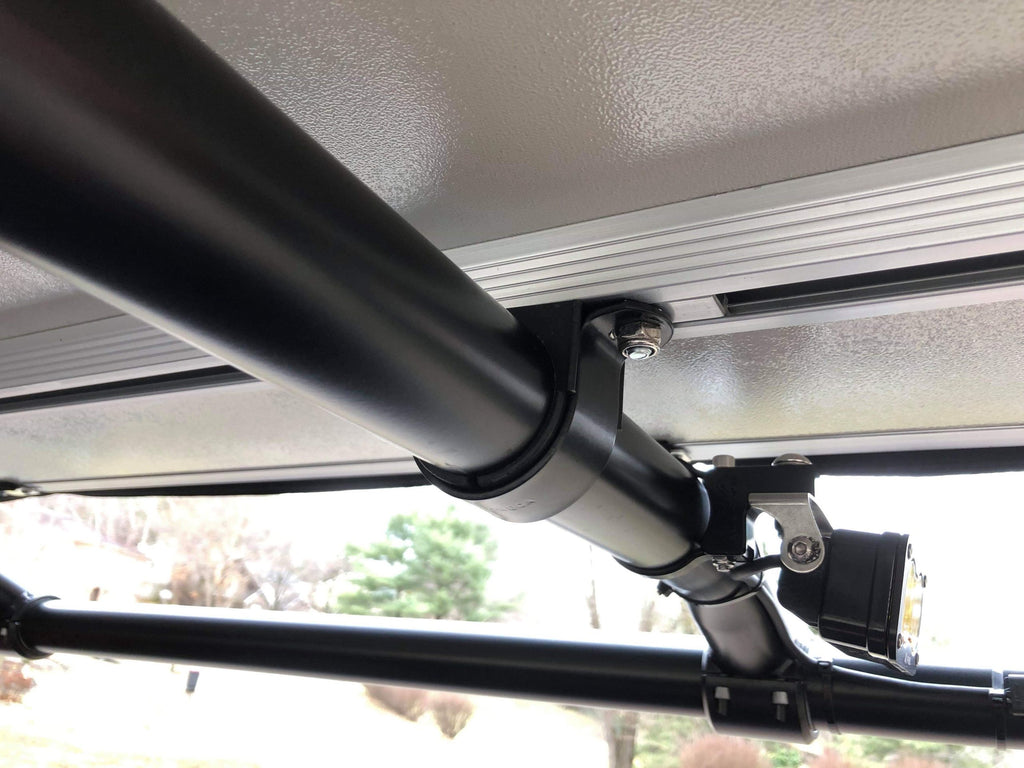The tent's mounting rail bolted to the rack tube, seen from under the open tent
