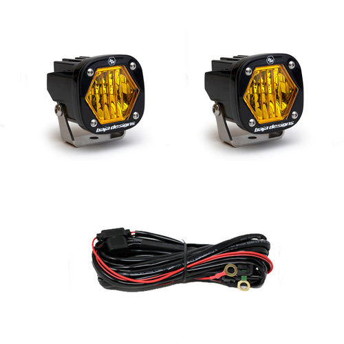 Pair of amber-lens pods with wide cornering optics, shown with the black wiring harness