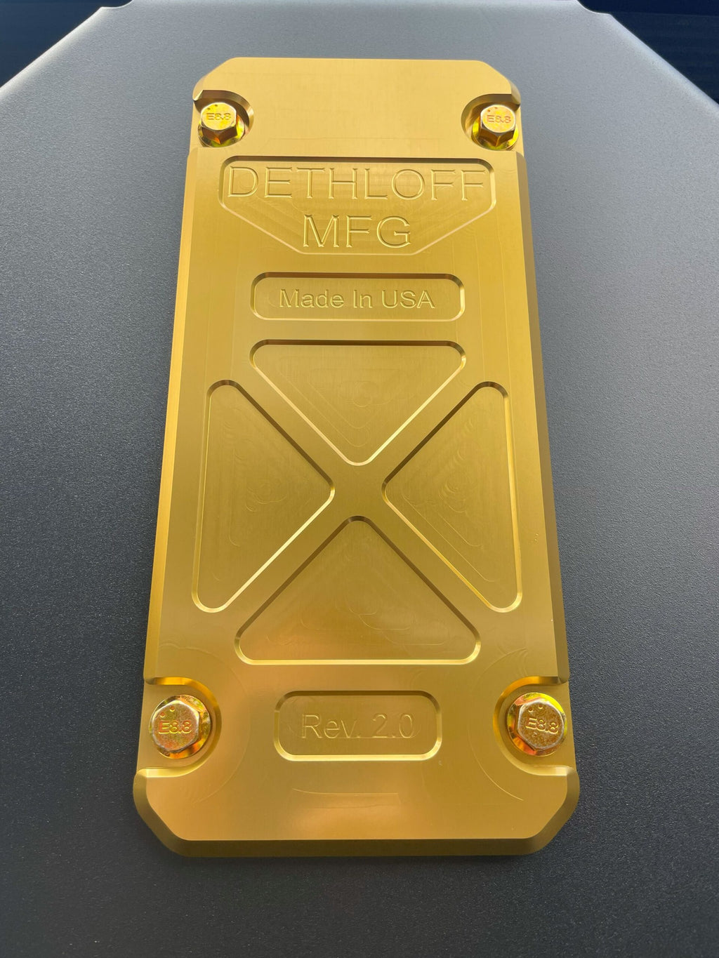 Close view of the service panel stamped DETHLOFF MFG, Made in USA, Rev 2.0