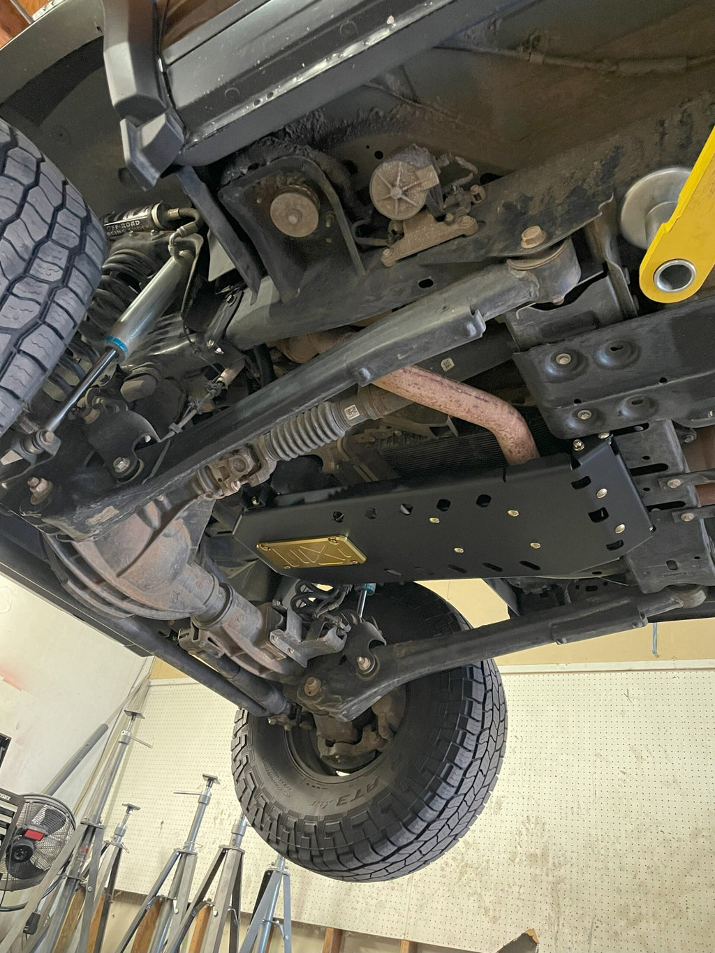 The armor fitted, seen from the front wheel looking back along the underside