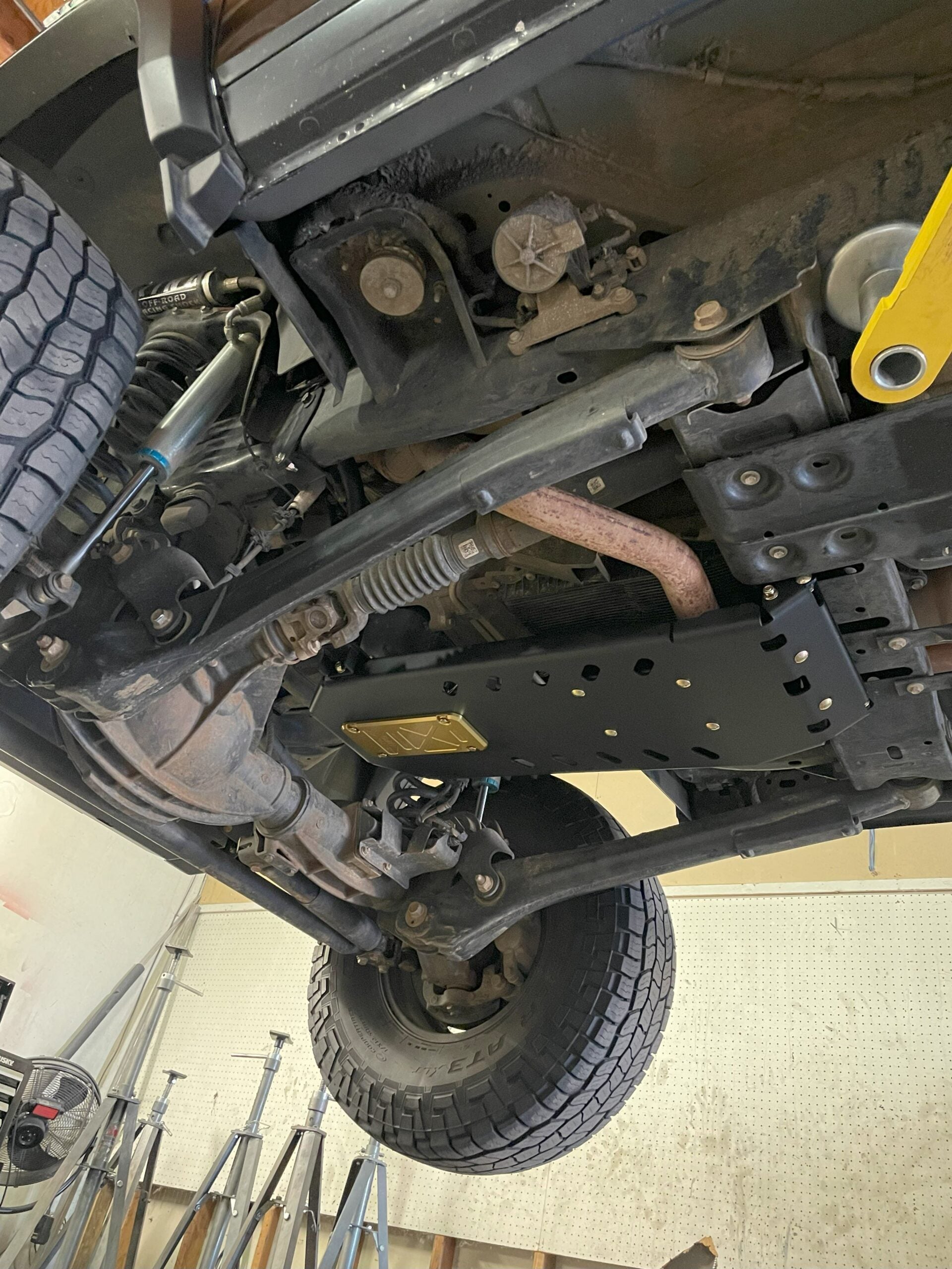 The armor fitted, seen from the front wheel looking back along the underside