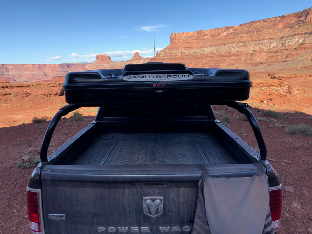 Rear view of the Power Wagon with the roof box overhead and a bag hung off the bedside