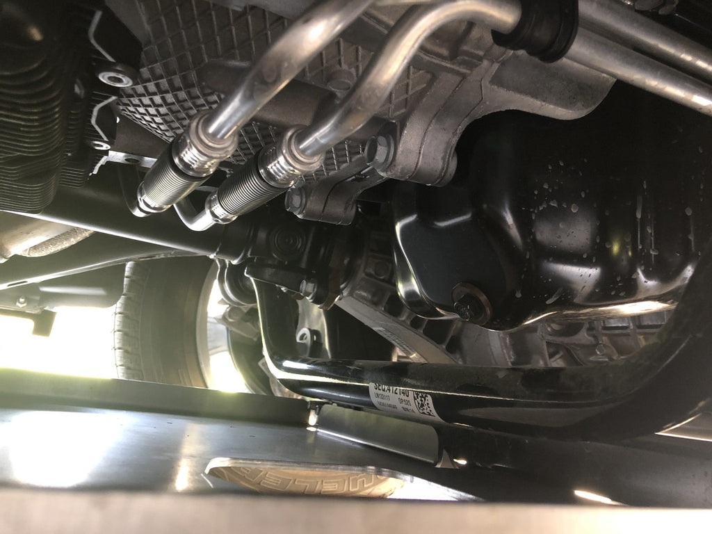 Front differential and axle shafts above the fitted plate, seen from below