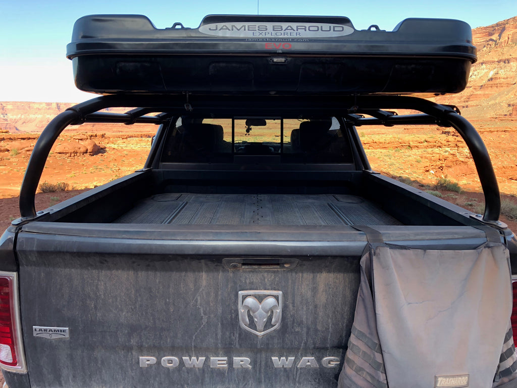 A roof box carried on the rack above the bed of a Power Wagon in red rock country