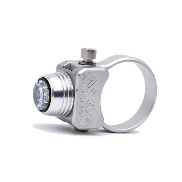 The same light and clamp in a silver finish, lens facing left