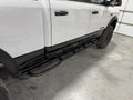 Slider fitted along the rocker of a white Ram in a garage, seen from the front wheel back