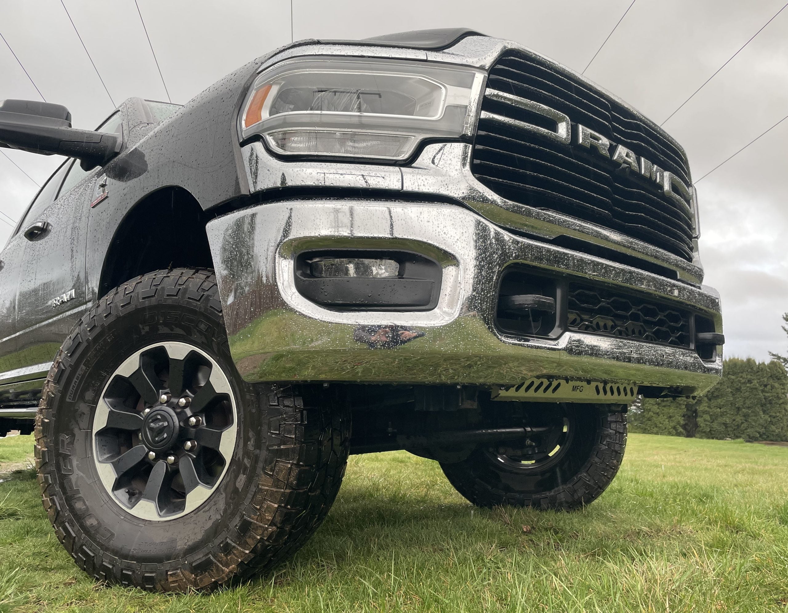 Front quarter of the Ram HD on grass with the guard fitted in the lower bumper