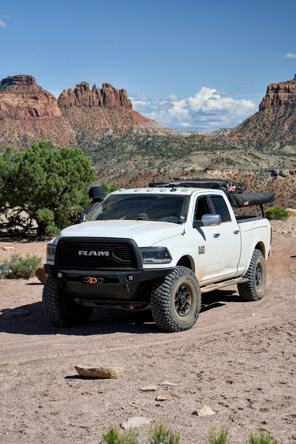 White Ram parked at a red rock overlook, sliders along the rockers