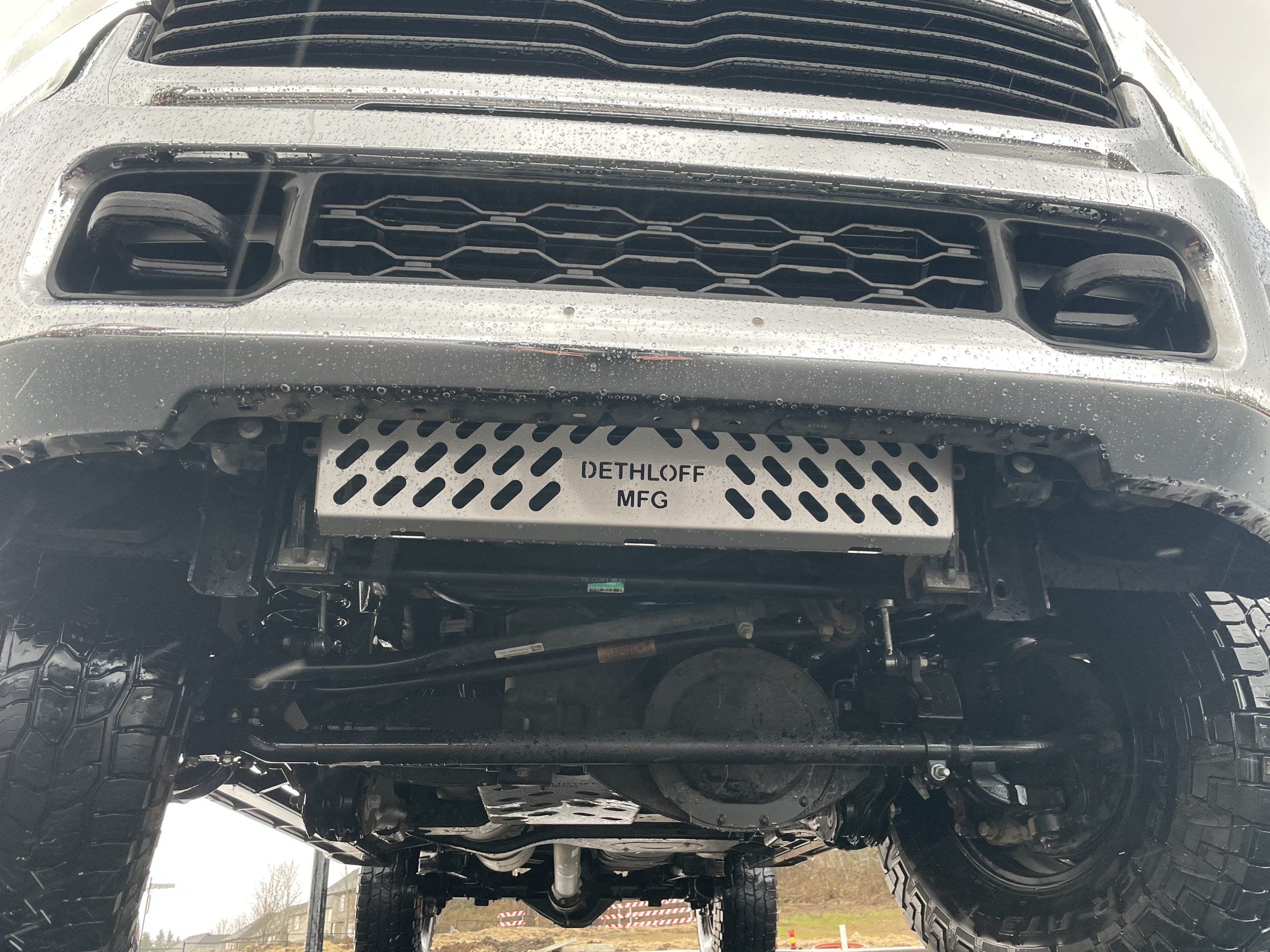 Head-on view of the truck's lower bumper with the perforated guard fitted across it