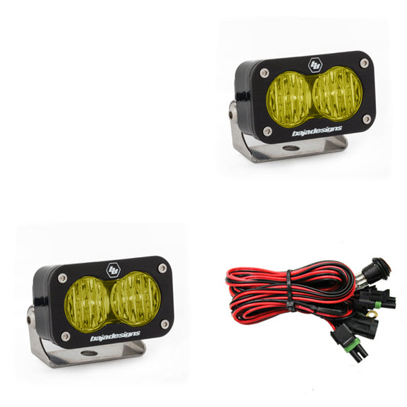 Pair of amber-lens pods with wide cornering optics, shown with the wiring harness