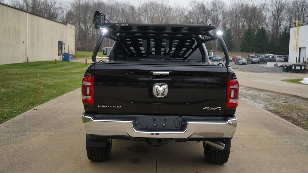 Straight rear view of the black Ram, lights and a slotted panel at the front of the rack