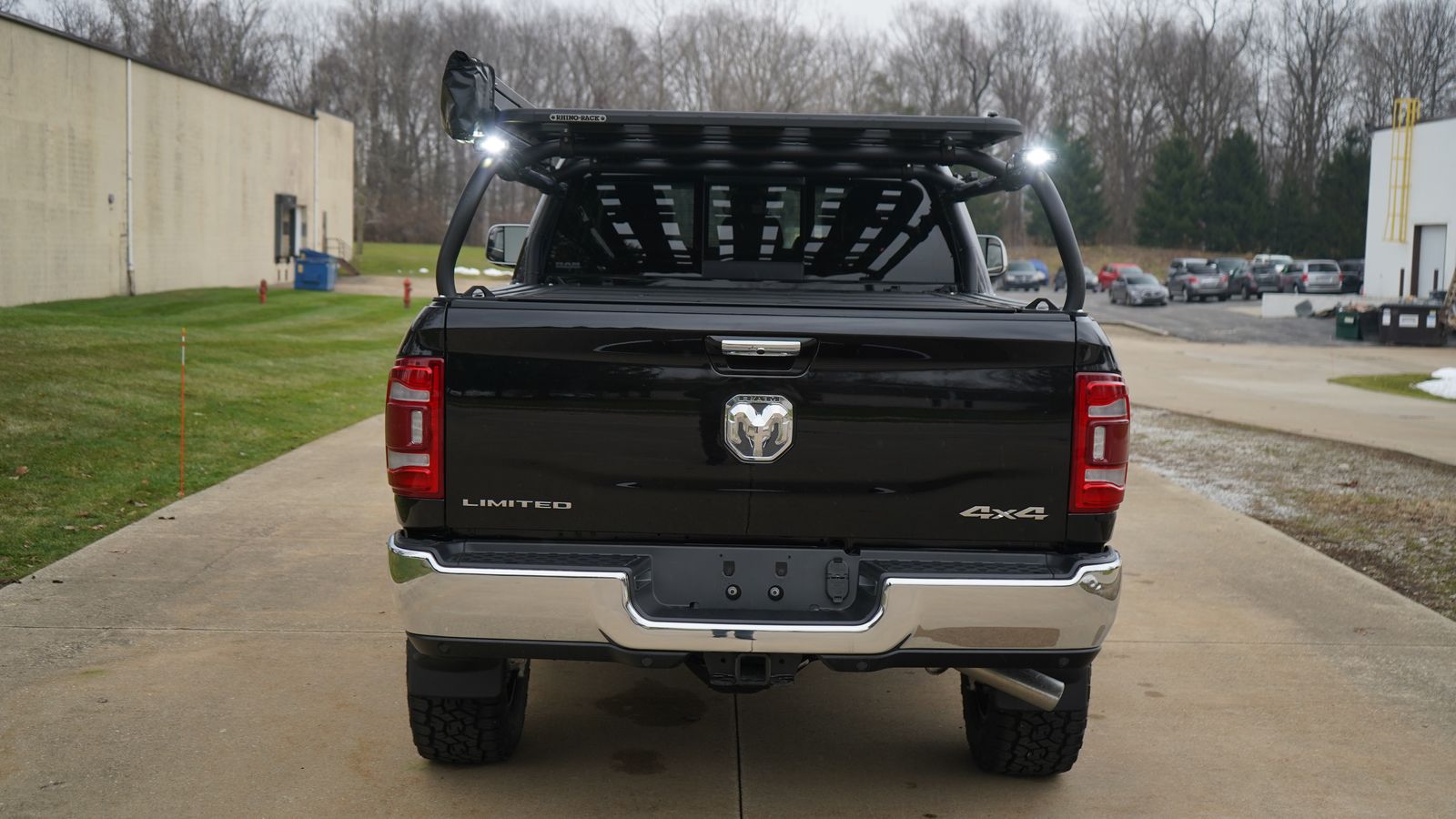 Straight rear view of the black Ram, lights and a slotted panel at the front of the rack