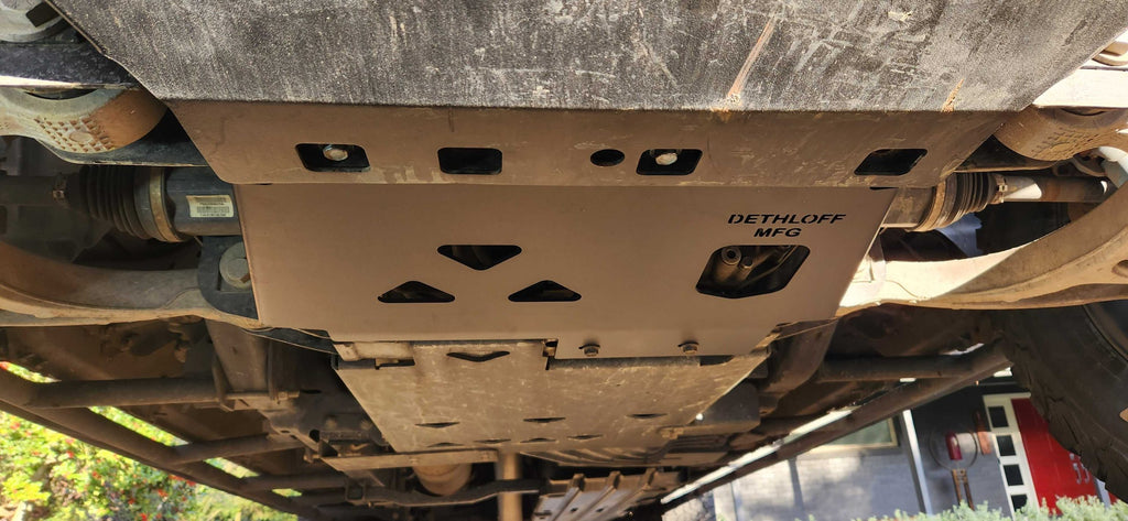 The plate fitted under the truck, seen from further back along the underbody