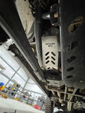 The guard in place along the frame rail with DETHLOFF MFG stamped into the aluminium above the slots