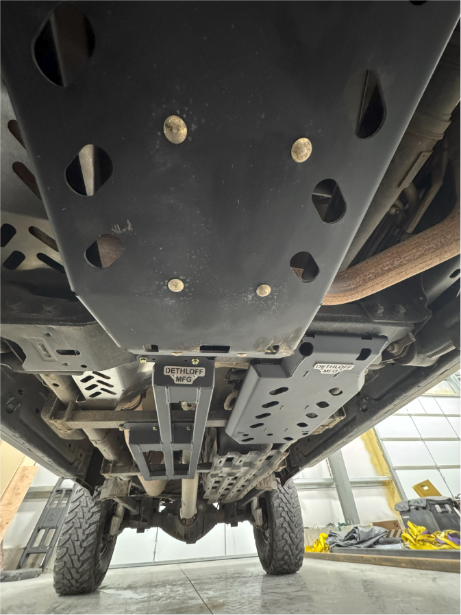 Engine and transmission skid plates installed, seen from under the truck