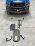 Dethloff armor kit laid out on the shop floor in front of a blue Ram 2500