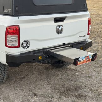 The utility drawer slid out from the bumper, license plate riding on the drawer face