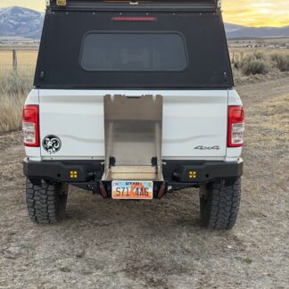 Rear of the truck at sunset, drawer open and its lid standing upright against the tailgate