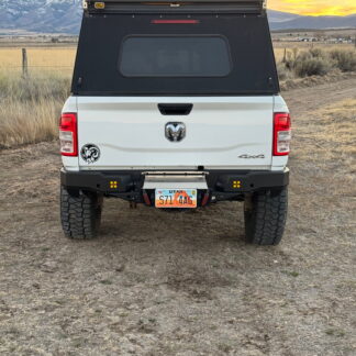Straight rear view at sunset with the drawer closed and mountains behind the truck