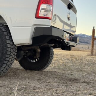 Low corner view showing how high the bumper wing sits above the rear tire