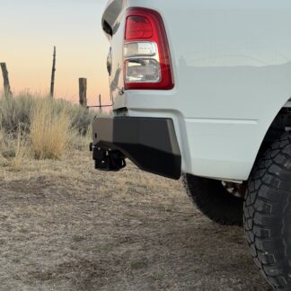 Bumper corner from a low side angle at sunset, hitch receiver under the center section