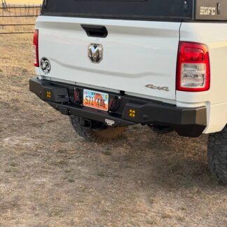 Rear three-quarter view of the white Ram with the bumper fitted and the drawer closed