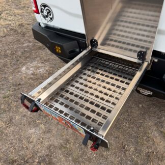 The open drawer with the slotted MOLLE floor panel fitted