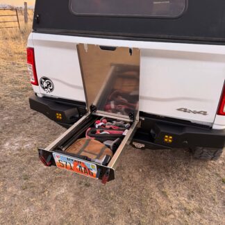 The drawer pulled out and loaded with recovery gear, lid propped open