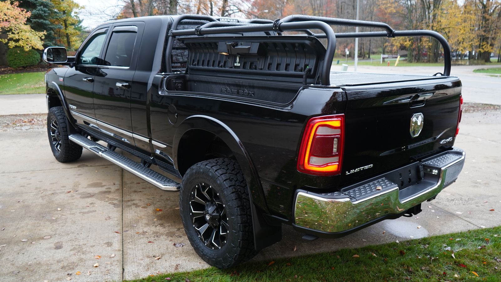 Rear quarter of the black Ram with a slotted panel mounted across the front of the rack