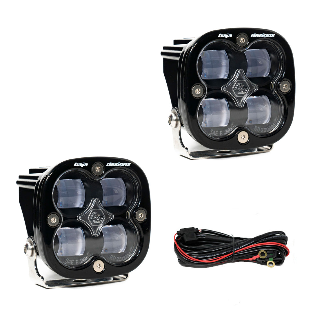 Two square pods with clear lenses over four optics, shown with a black wiring harness
