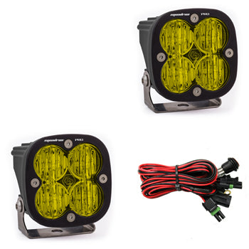 Pair of amber-lens pods with wide cornering optics, shown with the wiring harness