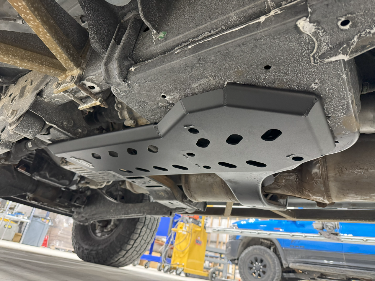 The fitted guard under the truck, seen along the frame rail