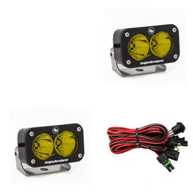 Pair of amber-lens pods with round optics, shown with the wiring harness