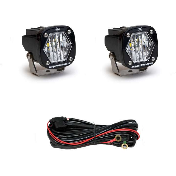 Pair of clear-lens pods with wide cornering optics, shown with the black wiring harness