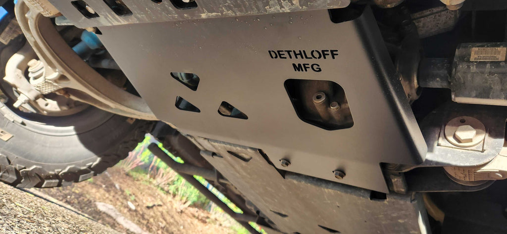 The armor plate fitted under the front of a truck, DETHLOFF MFG stamped on its face