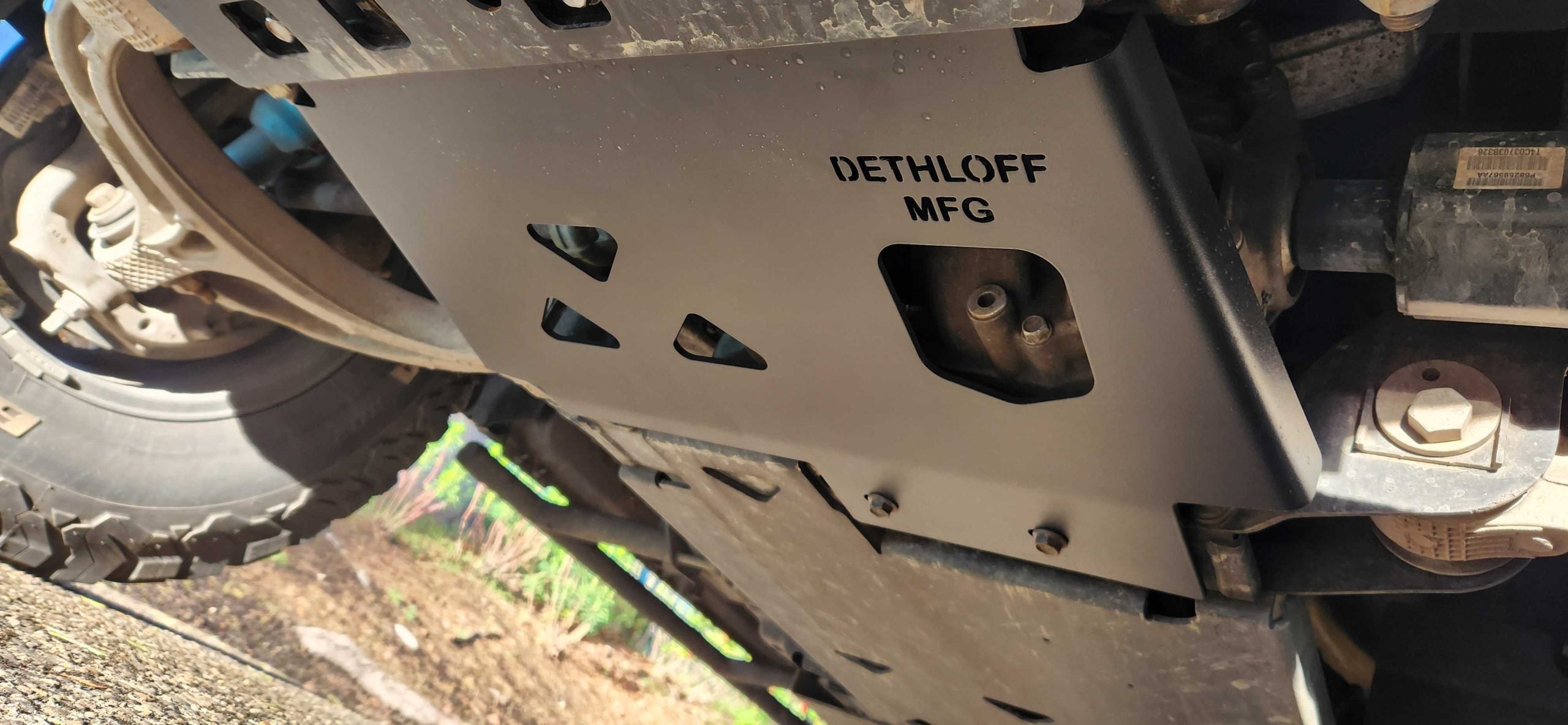 The armor plate fitted under the front of a truck, DETHLOFF MFG stamped on its face