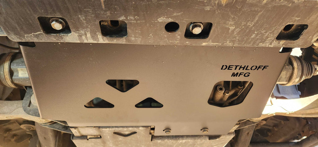 Underside of the truck with the plate spanning between the frame rails
