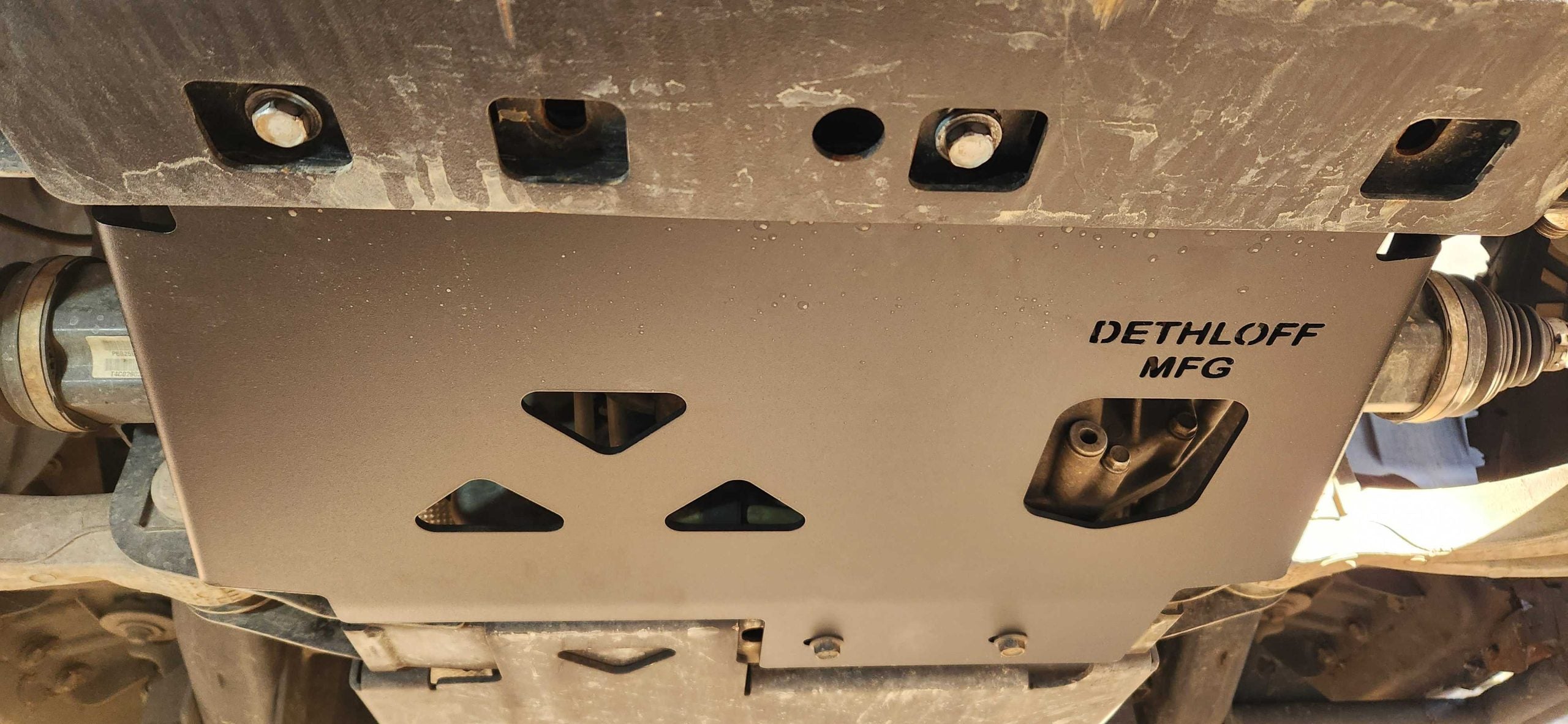 Underside of the truck with the plate spanning between the frame rails